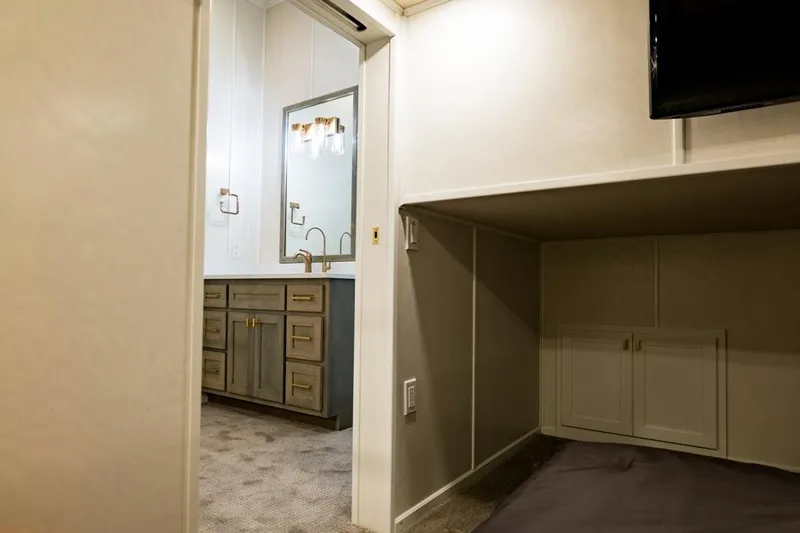 Slide: The Image of Interior of 2026 Sumerset Luxe III, featuring a modern bathroom and cozy sleeping area. - 14