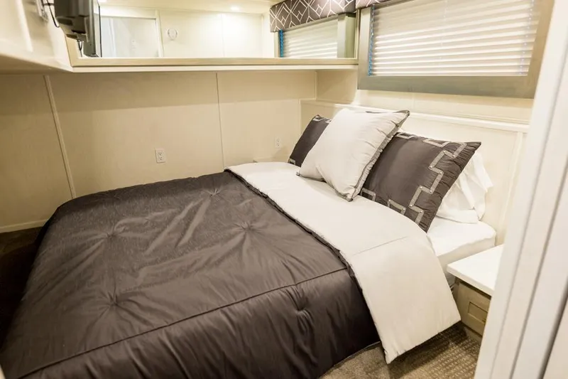 Slide: The Image of Luxurious bedroom interior in 2026 Sumerset Luxe III houseboat, featuring elegant bedding and modern design. - 15