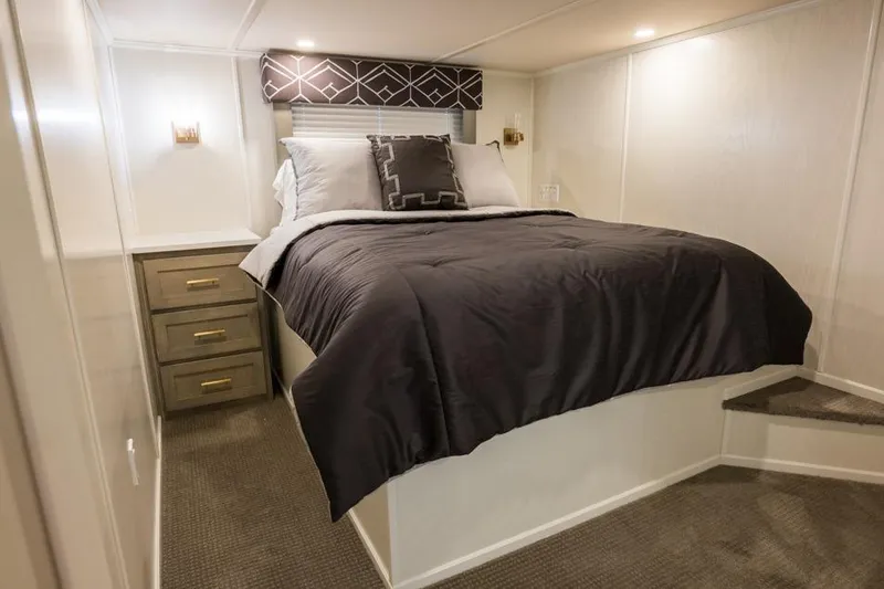 Slide: The Image of Luxurious bedroom interior of 2026 Sumerset Luxe III houseboat with elegant bedding and storage. - 3