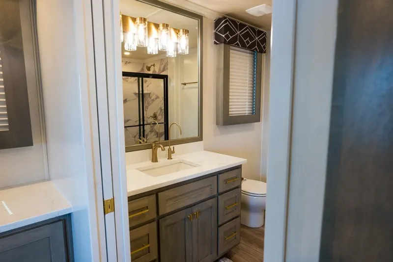 Slide: The Image of Luxurious bathroom in 2026 Sumerset Luxe III houseboat with elegant fixtures and modern design. - 5