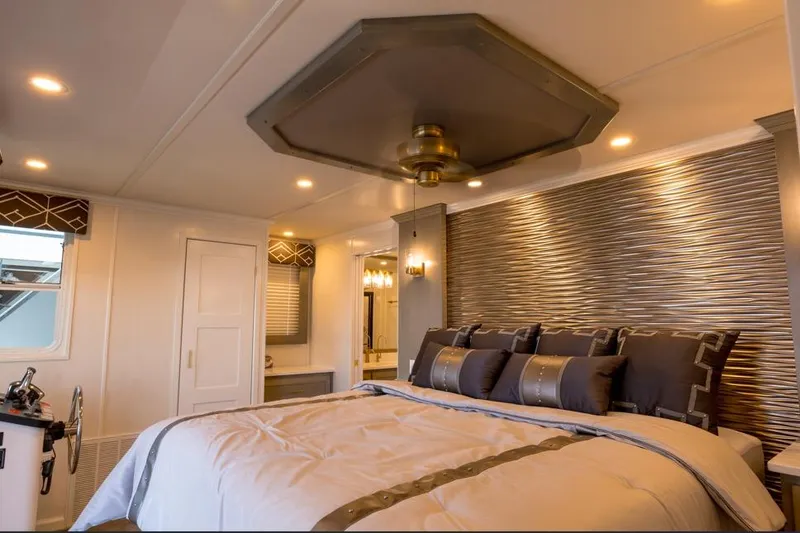 Slide: The Image of Luxurious bedroom interior in 2026 Sumerset Luxe III houseboat, featuring elegant decor and ambient lighting. - 8