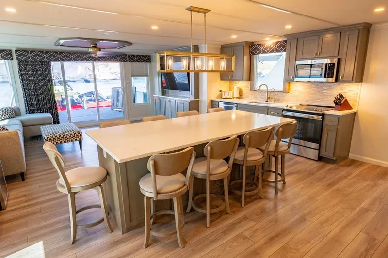 Slide: The Image of Luxurious Sumerset Luxe III 2026 houseboat kitchen with modern appliances and spacious seating area. - 9