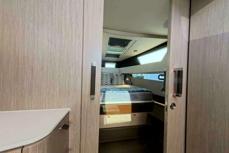 Slide: The Image of Luxurious cabin interior of 2024 Fjord 41XP yacht with modern wood finish. - 13