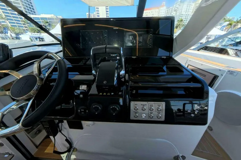 Slide: The Image of Helm of 2024 Fjord 41XP yacht with modern controls and navigation display. - 8