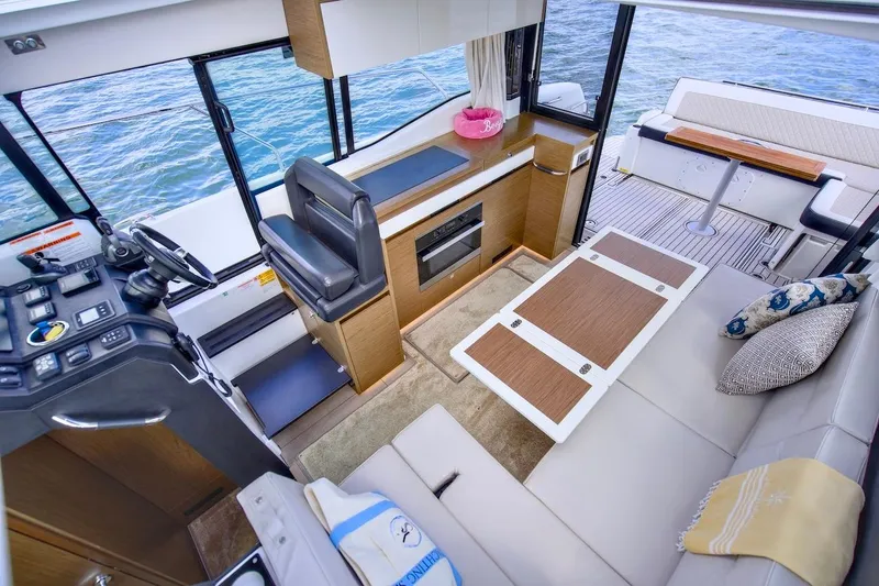 Slide: The Image of Interior of 2020 Jeanneau NC 37 yacht with modern seating and helm. - 17