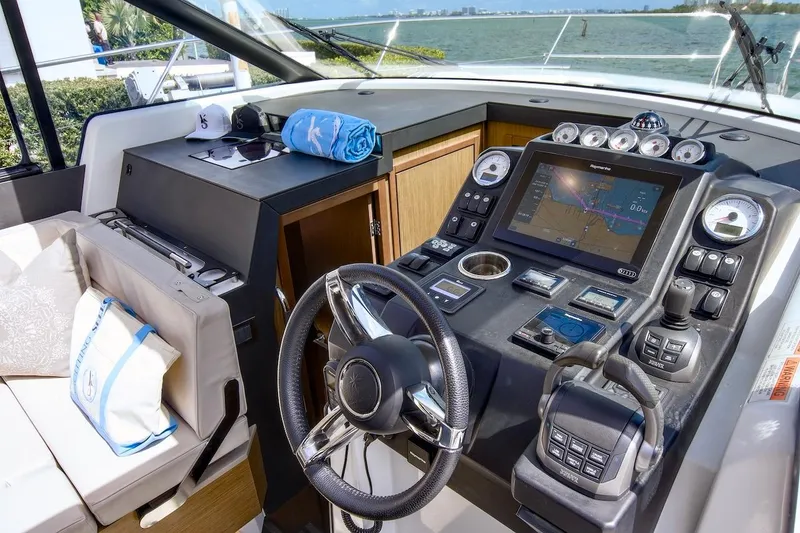 Slide: The Image of 2020 Jeanneau NC 37 helm with navigation system and luxurious seating. - 18