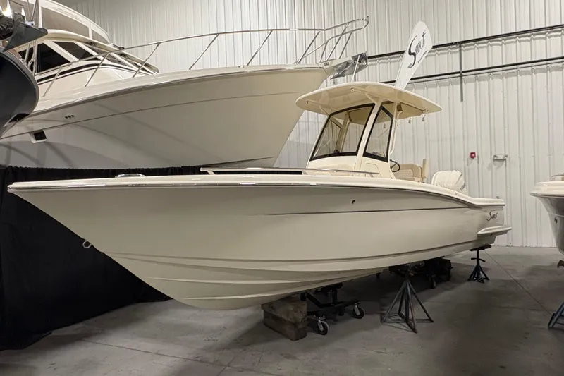 The Image of 2026 Scout 240 XSF boat displayed indoors on stands. - 0