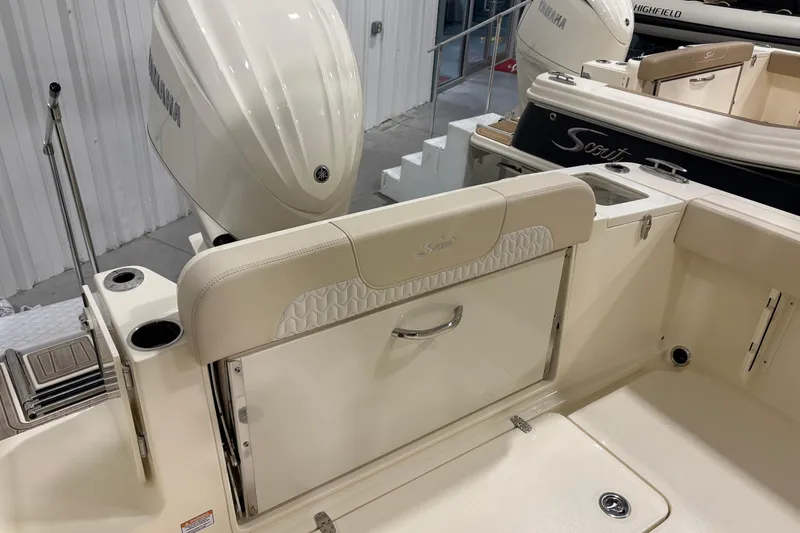 Slide: The Image of 2026 Scout 240 XSF boat interior with Yamaha engine, featuring seating and storage. - 14