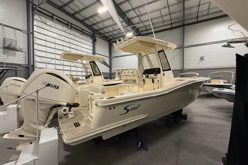 Slide: The Image of 2026 Scout 240 XSF boat in a warehouse, featuring Yamaha outboard motor. - 3