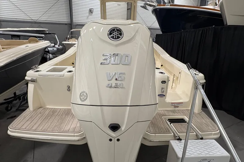Slide: The Image of 2026 Scout 240 XSF boat with 300 V6 engine in showroom. - 4