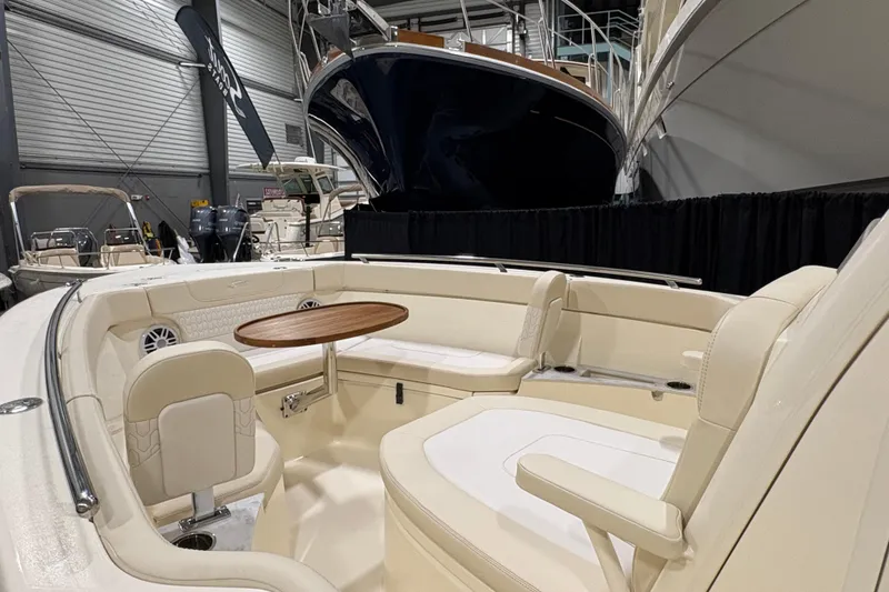 Slide: The Image of Luxurious interior of 2026 Scout 240 XSF boat with seating and table. - 7