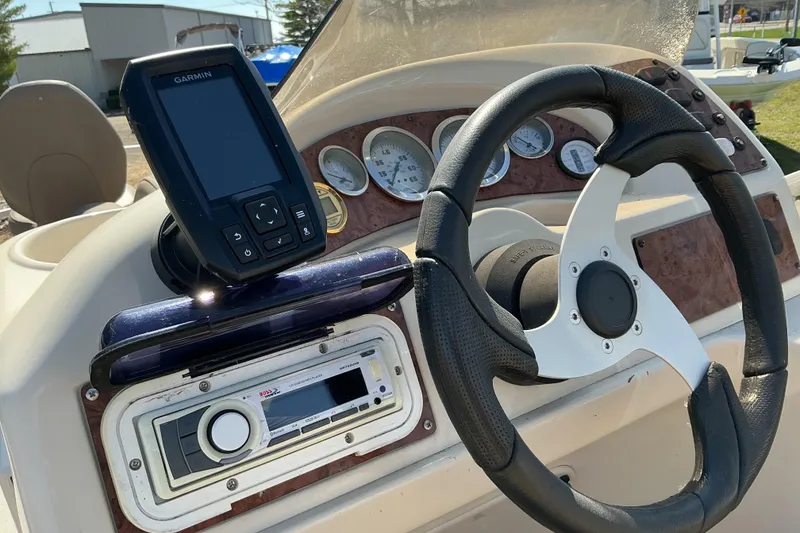 Slide: The Image of Steering console of 2004 Voyager Pontoons 22 Super Fish & Cruise with Garmin device. - 11