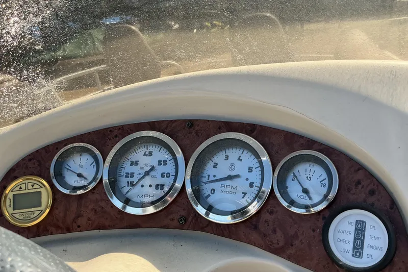 Slide: The Image of Dashboard of a 2004 Voyager Pontoons 22 Super Fish & Cruise boat with gauges. - 12