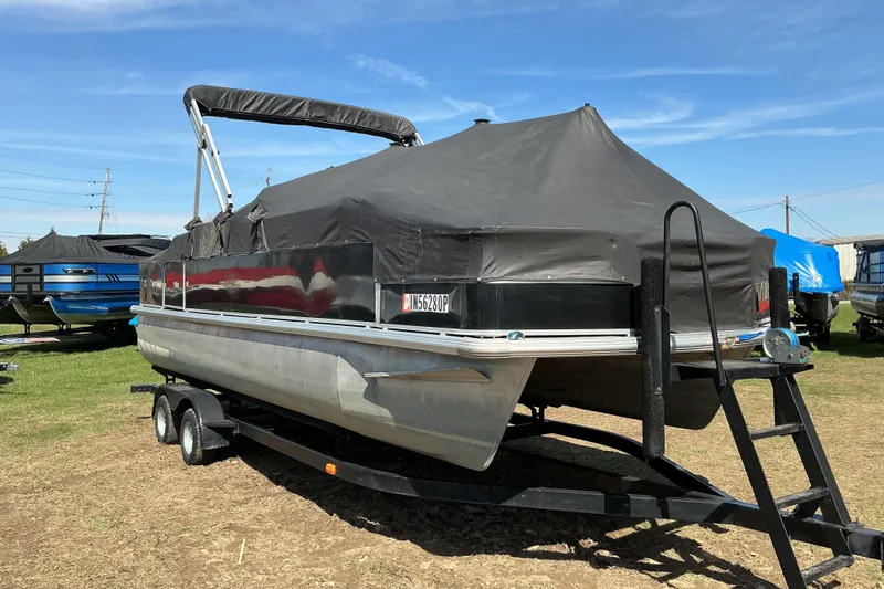 Slide: The Image of 2004 Voyager Pontoons 22 Super Fish & Cruise on trailer, covered and parked outdoors. - 15