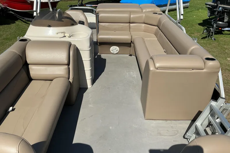Slide: The Image of 2004 Voyager Pontoons 22 Super Fish & Cruise interior with beige seating and helm. - 7