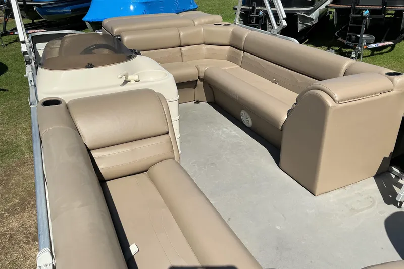 Slide: The Image of 2004 Voyager Pontoons 22 Super Fish & Cruise interior with beige seating. - 9