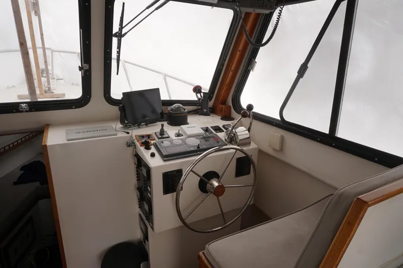 Slide: The Image of Interior helm of 1999 Eastern 31 Casco Bay boat with navigation equipment. - 16