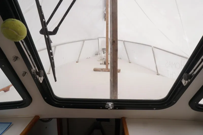 Slide: The Image of Interior view of a 1999 Eastern 31 Casco Bay boat through a window. - 17