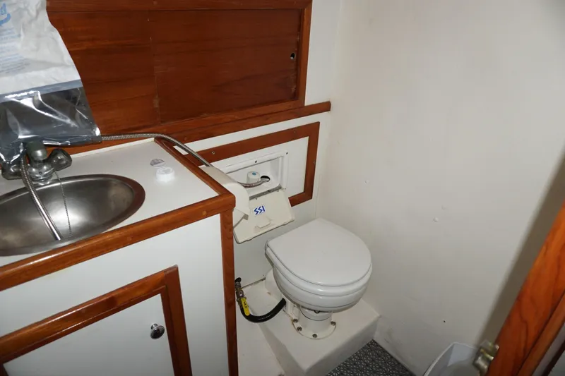 Slide: The Image of Compact marine bathroom with sink and toilet on 1999 Eastern 31 Casco Bay boat. - 8