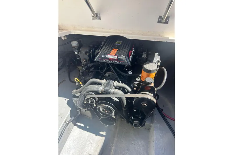 Slide: The Image of Engine compartment of a 1999 Chaparral Signature 240 boat. - 11