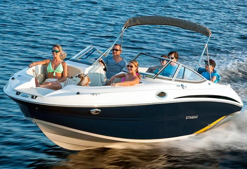 Slide: The Image of Manufacturer Provided Image: 2018 Stingray 234 LR boat cruising with passengers on a sunny day. - 11