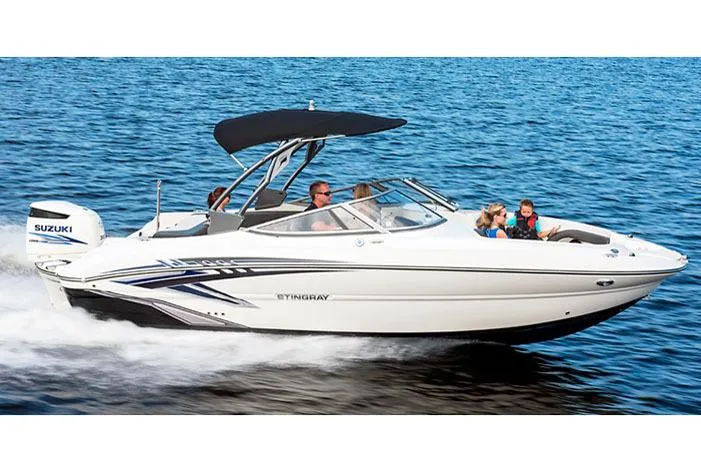 Slide: The Image of Manufacturer Provided Image: 2018 Stingray 234 LR boat cruising on water with passengers. - 9