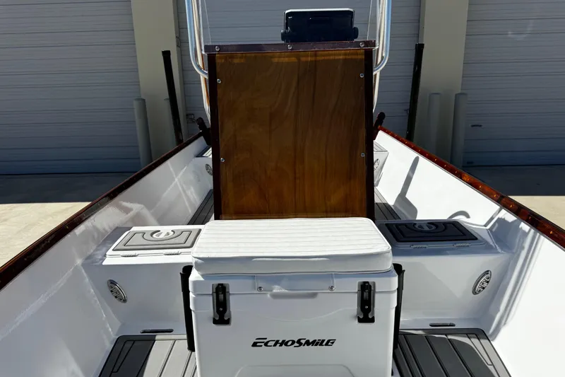Slide: The Image of 2022 Farley Port A Skiff interior with EchoSmile cooler, wooden console, and storage compartments. - 23