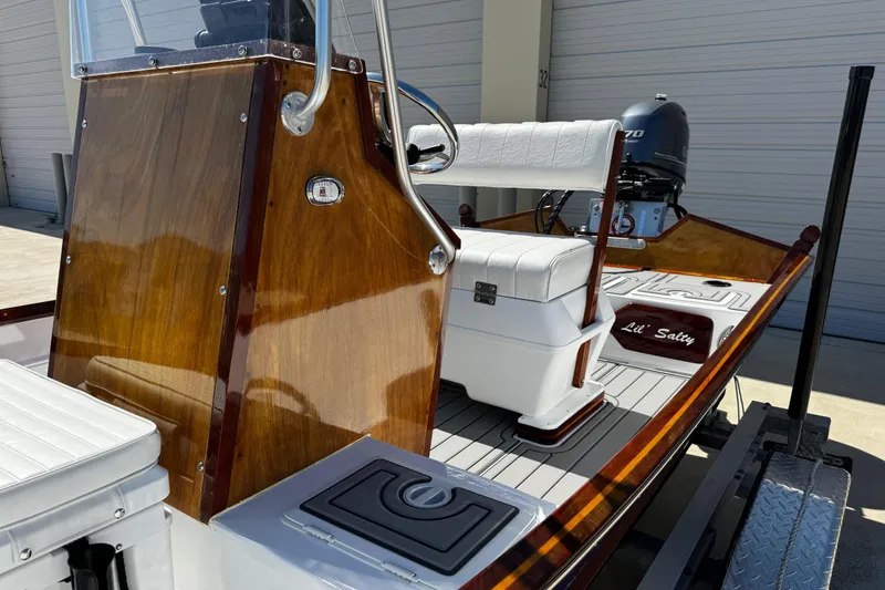 Slide: The Image of 2022 Farley Port A Skiff boat with wooden console and white seating. - 25