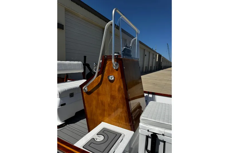 Slide: The Image of 2022 Farley Port A Skiff boat interior with wooden console and seating. - 26
