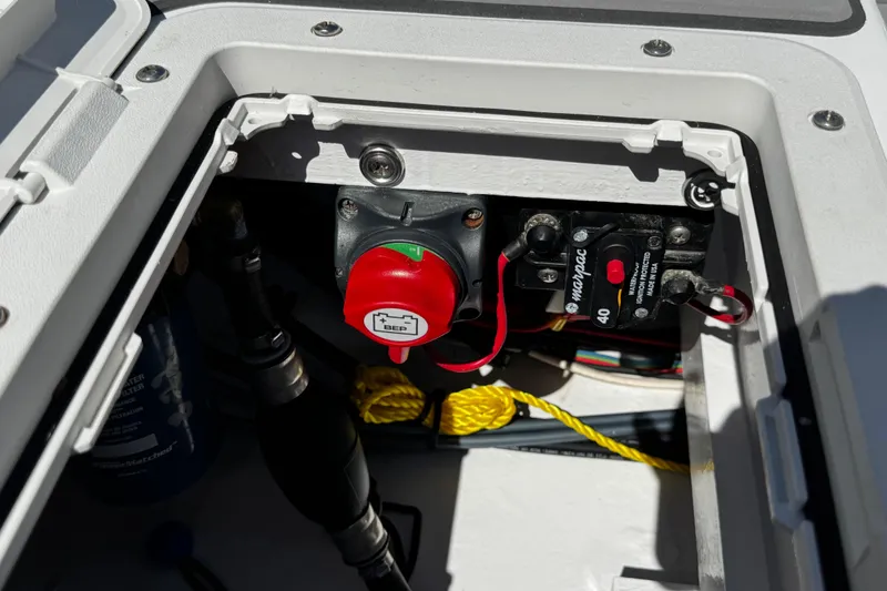 Slide: The Image of Electrical compartment of 2022 Farley Port A Skiff with battery switch and wiring. - 27