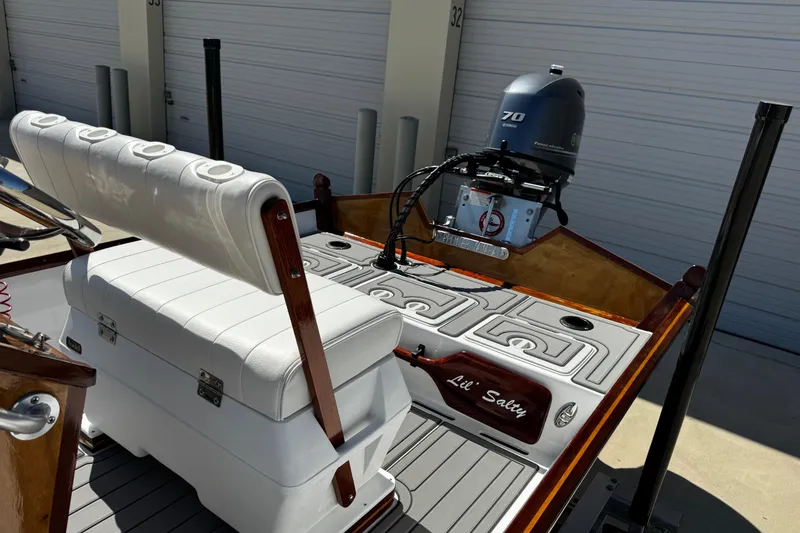 Slide: The Image of 2022 Farley Port A Skiff boat with Yamaha 70 engine, white seating, and custom deck. - 30