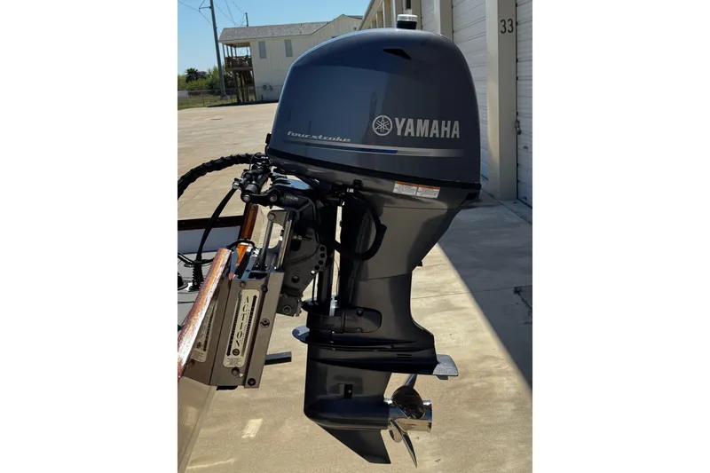 Slide: The Image of Yamaha outboard motor on 2022 Farley Port A Skiff, parked near storage units. - 5