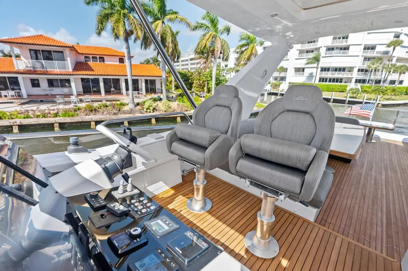 Slide: The Image of Luxurious 2020 Azimut 66 yacht helm with plush seating and modern controls. - 14