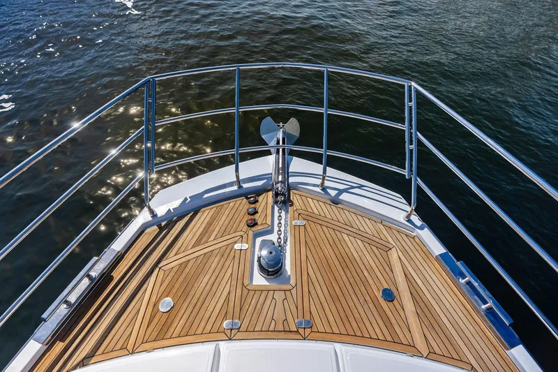 Slide: The Image of Bow of 2020 Azimut 66 yacht with teak decking and stainless steel railings. - 17