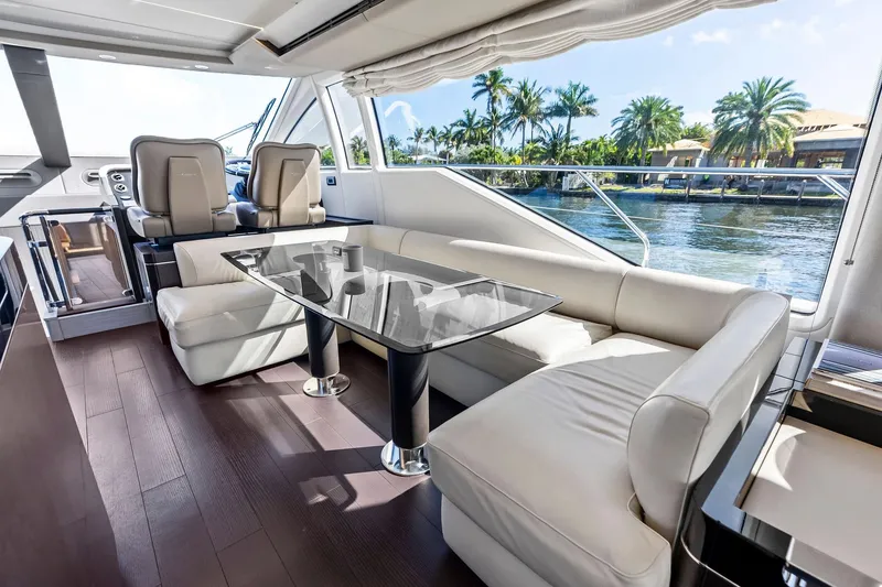 Slide: The Image of Luxurious interior of 2020 Azimut 66 yacht with elegant seating and glass table. - 20