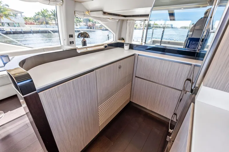 Slide: The Image of Modern kitchen interior on 2020 Azimut 66 yacht with sleek cabinetry and waterfront view. - 22