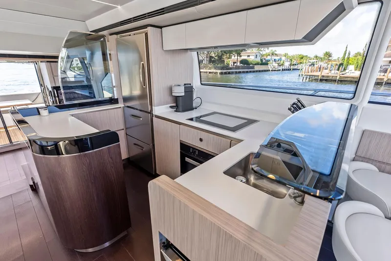 Slide: The Image of Luxurious kitchen interior of 2020 Azimut 66 yacht with modern appliances and waterfront view. - 26