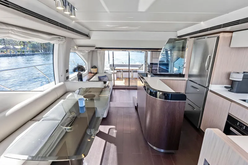 Slide: The Image of Luxurious interior of a 2020 Azimut 66 yacht with modern kitchen and dining area. - 28