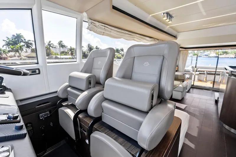 Slide: The Image of Luxurious interior of 2020 Azimut 66 yacht with plush seating and panoramic windows. - 31