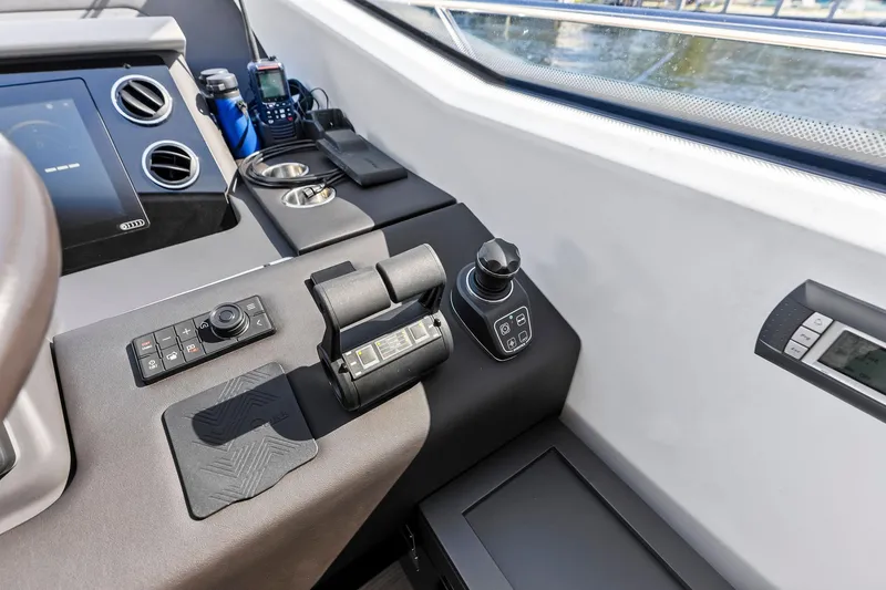 Slide: The Image of Control panel of a 2020 Azimut 66 yacht, featuring modern navigation equipment. - 33
