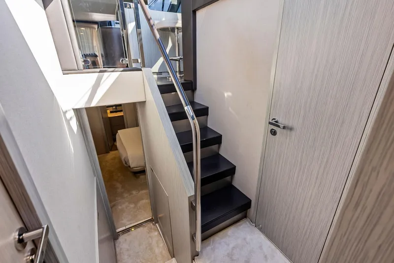 Slide: The Image of Interior staircase of 2020 Azimut 66 yacht, featuring modern design and sleek finishes. - 34