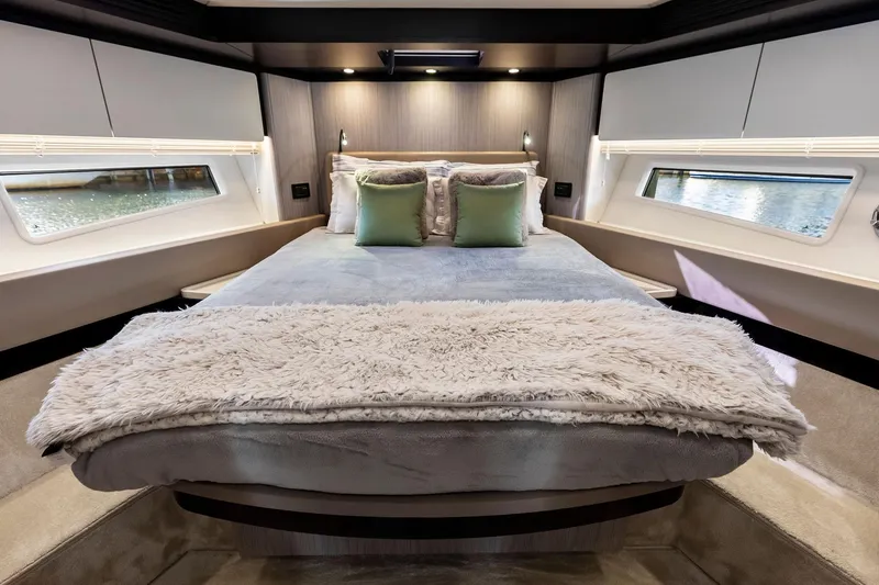 Slide: The Image of Luxurious bedroom interior of 2020 Azimut 66 yacht with plush bedding and elegant design. - 35