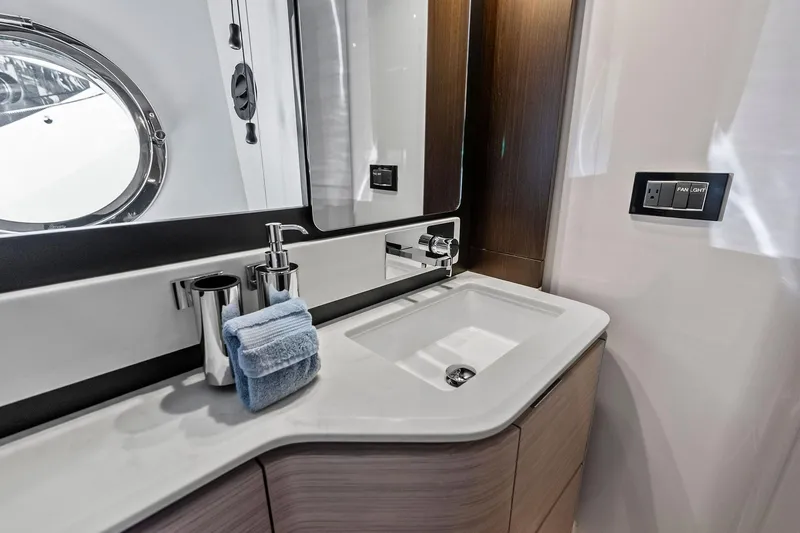 Slide: The Image of Luxurious bathroom interior of 2020 Azimut 66 yacht with modern sink and mirror. - 38