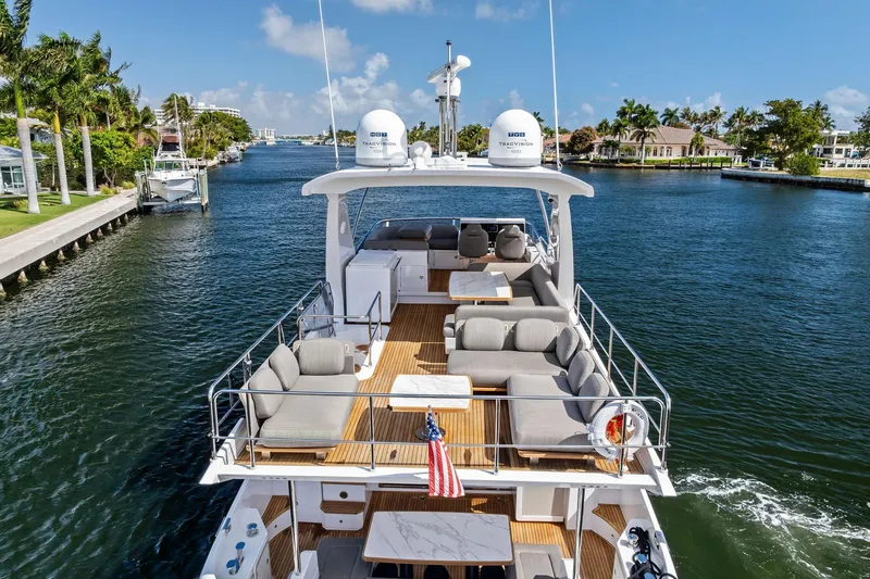 Slide: The Image of Luxurious 2020 Azimut 66 yacht cruising on a scenic waterway with elegant seating. - 4