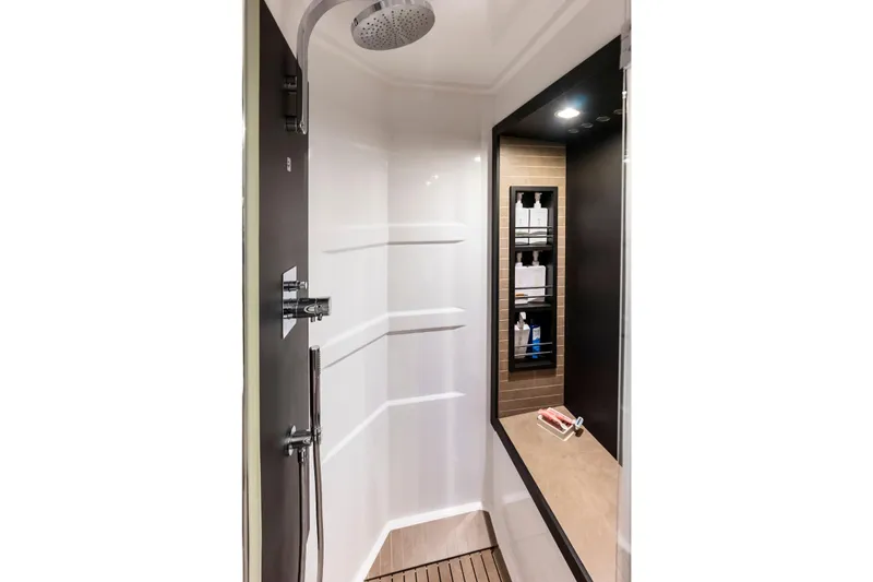 Slide: The Image of Luxurious shower area in 2020 Azimut 66 yacht, featuring modern fixtures and shelving. - 43