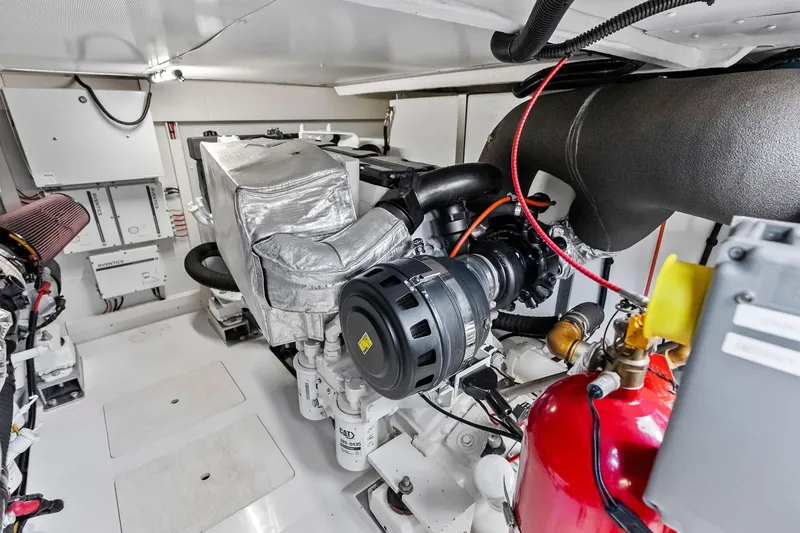 Slide: The Image of Engine room of a 2020 Azimut 66 yacht, showcasing mechanical components and systems. - 52