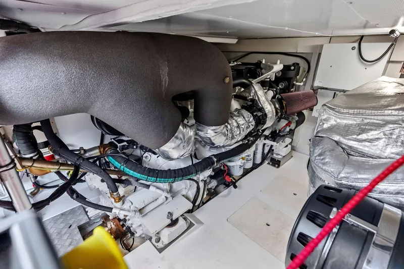Slide: The Image of Engine room of a 2020 Azimut 66 yacht, showcasing complex machinery and components. - 53