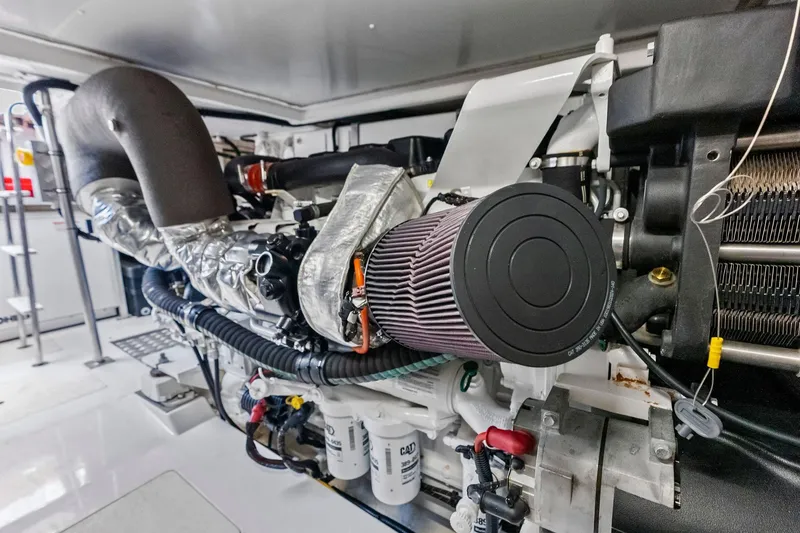 Slide: The Image of Engine room of a 2020 Azimut 66 yacht, showcasing detailed machinery components. - 56