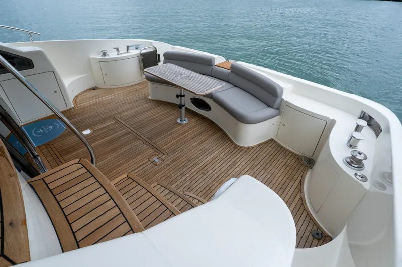 Slide: The Image of Luxurious 2008 Azimut 62E yacht deck with elegant seating and teak flooring. - 10