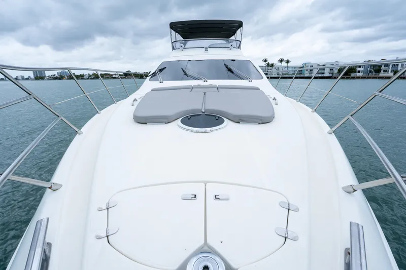 Slide: The Image of 2008 Azimut 62E yacht deck view with sleek design and ocean backdrop. - 12